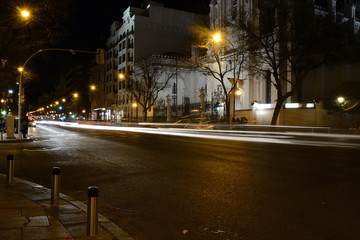 Rays of lights, car lights in a street, by night