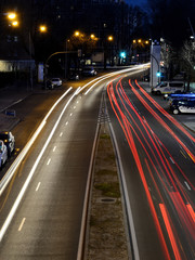 Rays of lights, car lights in a street, by night
