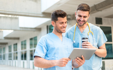 male nurse vet with stethoscope  and tablet