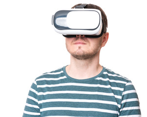 Man wearing virtual reality goggles watching movies or playing video games - closeup. Male looking in VR glasses, isolated on white background.