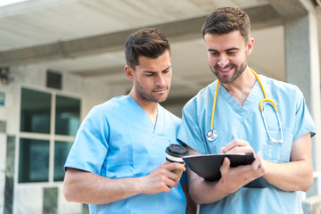 male nurse vet with stethoscope  and coffee