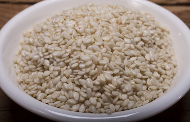 Fresh sesame seeds in white plate