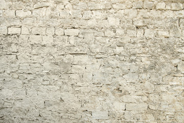 Old beige stone wall background