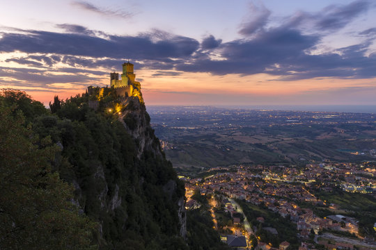 Sunset over San Marino's Torre Guaita and Emilia Romagna plains, Monte Titano, San Marino.