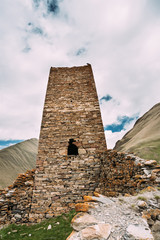 Fototapeta na wymiar Watchtower Of Ancient Fortress On Mountain Background Near Karatkau