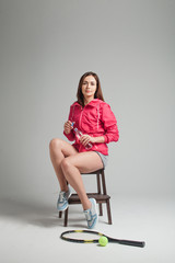 Fototapeta premium Young woman relaxing after tennis training.