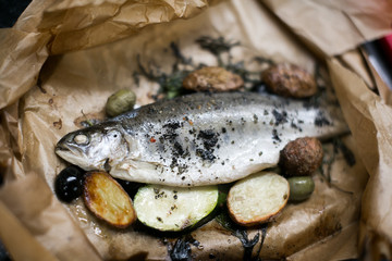 Baked fish with potatoes in paper