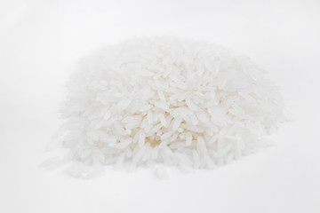 Fototapeta na wymiar Hill rice grains on a white background, close-up
