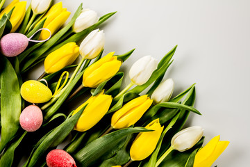 Tulips and eggs on golden wood, easter theme