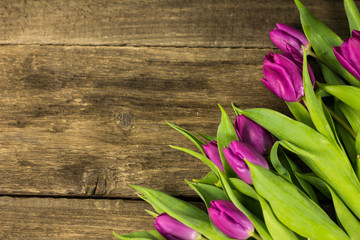 Tulips on golden wooden desk. place for typography