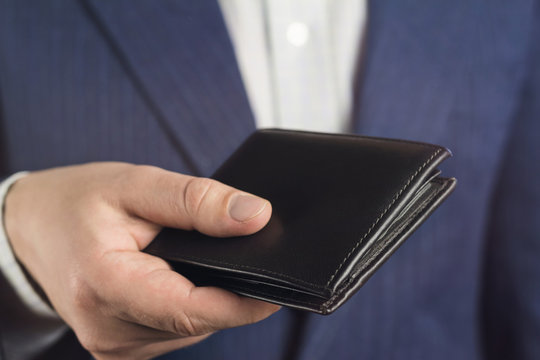 Business Man Hold In His Hand Leather Wallet.