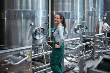 Female factory worker standing 