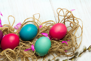 Fototapeta na wymiar Easter background with colorful egg and catkins, copy space
