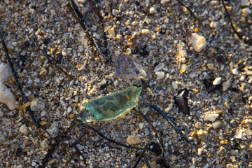 Broken Glass in Sand