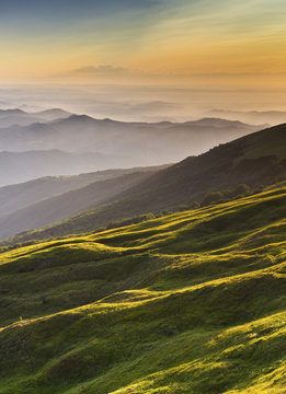 Ligurian Apennines, Piedmont, Italy. The sunset lights up the hillside of Mount Ebro.