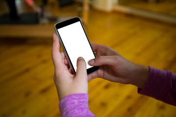 Hand on a woman using mobile phone