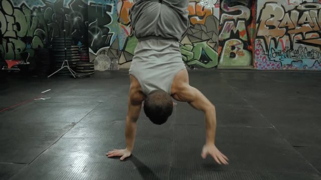 Sport healthy power young man working out,crossfit fitness training, doing acrobatics exercise, acrobat athlete