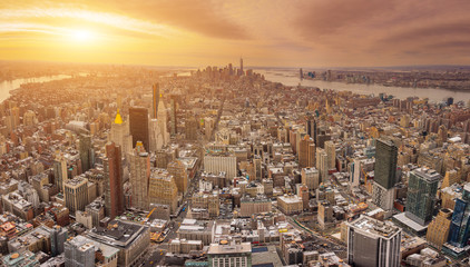 The New York City USA .Manhattan downtown and New Jersey skyline skyscrapers at sunset with the Freedom tower and Brooklyn bridge. Extreme Panorama