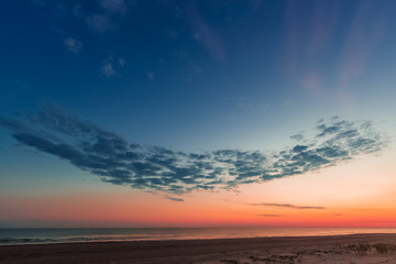 Blue cloudy sky over the Baltic sea at evening