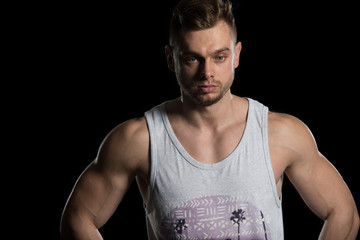 Muscular Men Flexing Muscles On Black Background