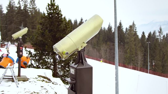 Man looking mountain through monocular binocular on tv tower
