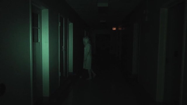 A night-vision camera catches a ghost walking the halls of an abandoned hospital.