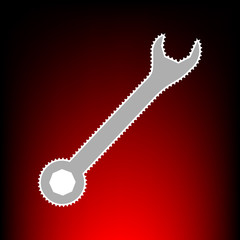 Crossed wrenches sign. Postage stamp or old photo style on red-black gradient background.