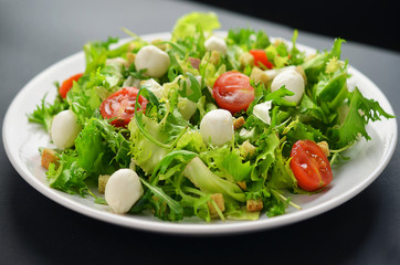 Fresh salad on white plate
