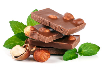 Chocolate with hazelnut and mint leaf isolated on white background