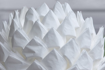 Product crafts made from paper napkins. White paper napkins nicely folded. For the background, for design