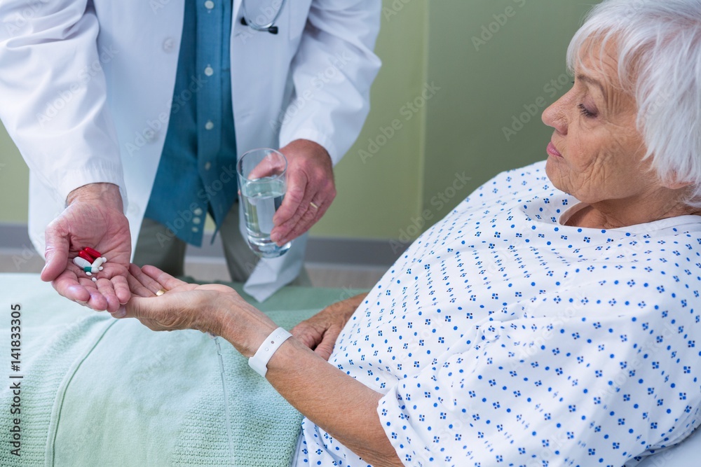 Sticker Doctor giving medicine pill to senior patient