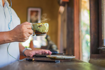 A man holding a cup of coffee
