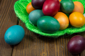 Colored easter eggs in basket
