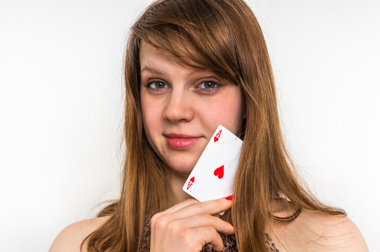 Sexy woman with poker card isolated on white