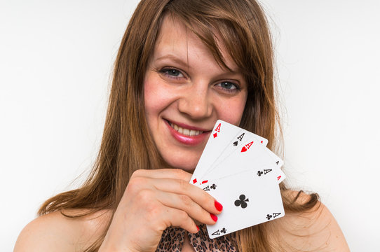 Attractive woman with poker cards isolated on white