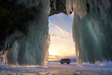Ice cave on Olkhon island on Baikal lake in Siberia at winter time - obrazy, fototapety, plakaty