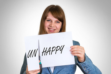 Woman cutting paper by scissors with unhappy word