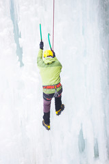 The climber climbs on ice.