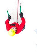 The climber climbs on ice.