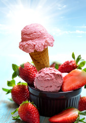Ice cream cone with strawberry on the table with sky background