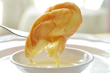 twist bread dipping sweetened condensed milk stab in fork