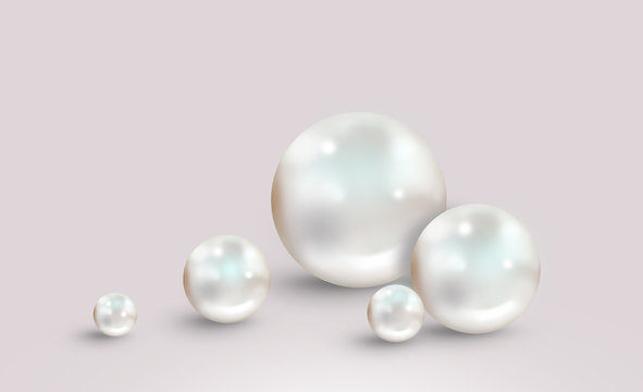 Five white pearls on grey pink background