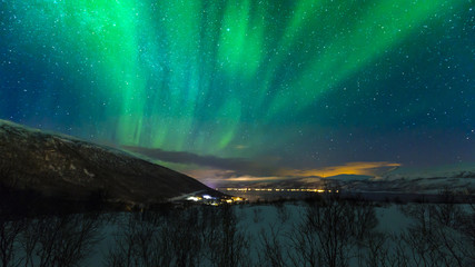 Northern lights above the village Hansnes, Troms county Norway