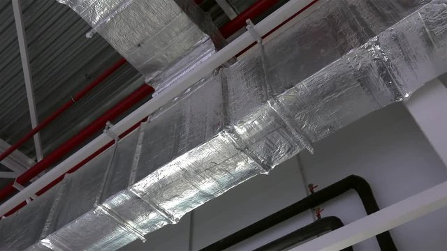 Air ducts for conditioning and ventilation & fire extinguishing pipes at an industrial facility.