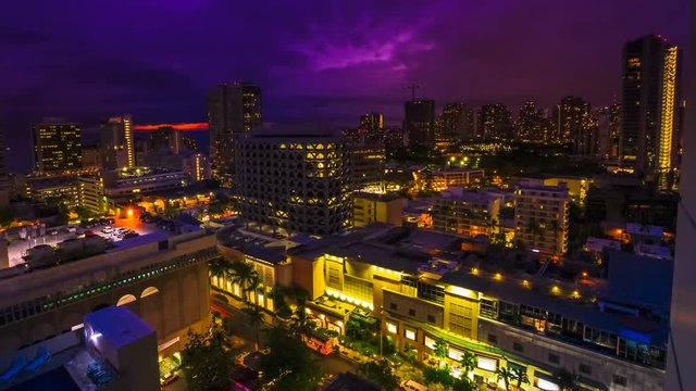 close up time lapse on changing light twilight of Waikiki skyline. Oahu, Hawaii, United States. City colorful lights and nightlife concept.