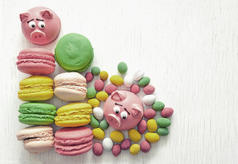 sweet delicate macaroon pink macaroons , marshmallows, peanuts in sugar pastel colours on a light background with place for text