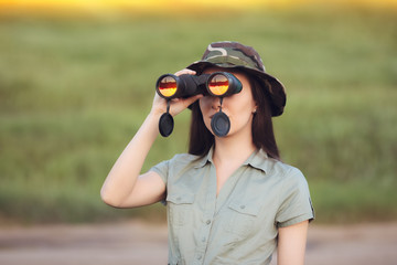 Explorer Girl with Camouflage Hat and Binoculars  © nicoletaionescu