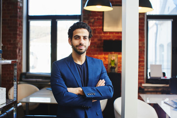 Portrait of an Arab businessman in a jacket in the office