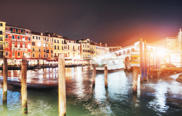 Fototapeta premium City landscape. Rialto Bridge Ponte Di Rialto in Venice, Italy at night. Many tourists visiting the beauty of the city throughout the year