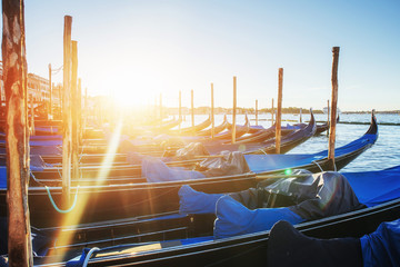 Gondolas in Venice - sunset with San Giorgio Maggiore church. Venice, Italy